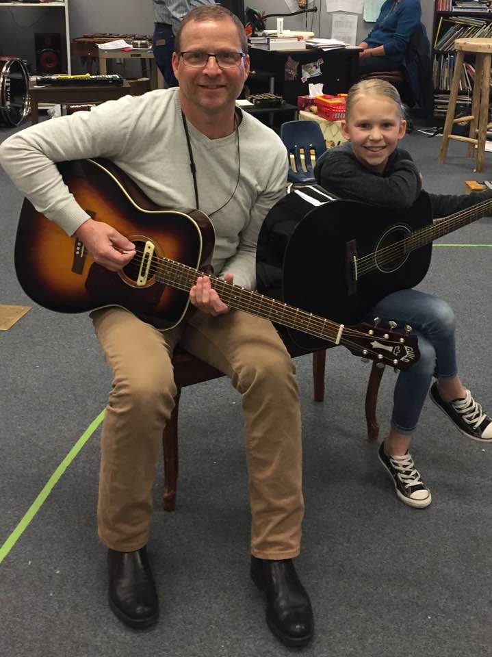 Guitarist Tommy Fedak teaches children
